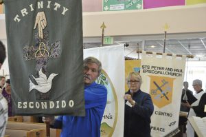 Scott Sexton carrying the Trinity banner in precessional